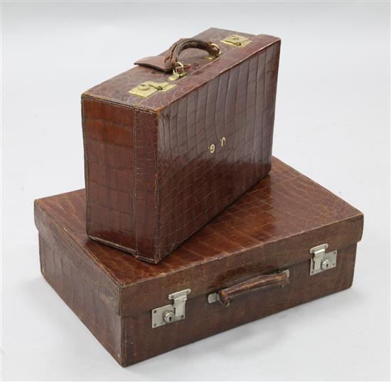 An early 20th century crocodile suitcase, 20in.